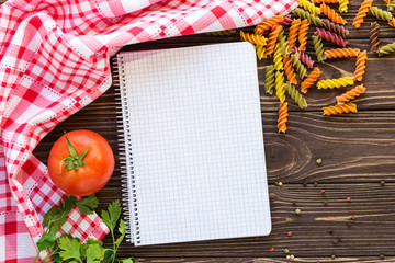 Open blank recipe book on wooden background