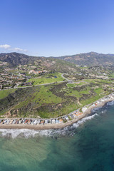 Aerial view of Malibu beach homes and hillsides in Southern California.