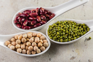 mix of beans on wooden table