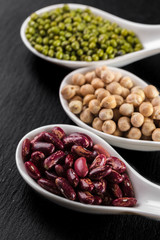 mix of beans on wooden table