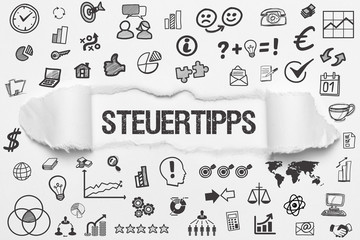 Steuertipps / weißes Papier mit Symbole