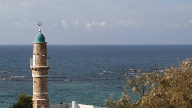 Minaret in the Old Jaffa on the background of the mediterranean sea, Tel Aviv, Israel.