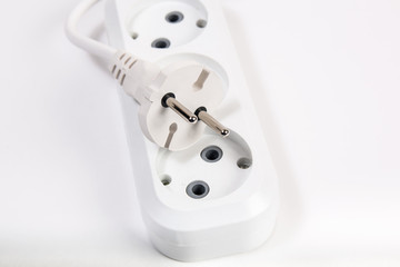 Electric splitter and plug. Contacts and cables.Electrical extension cord.