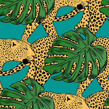 vector leopards in colorful tropical flowers seamless background.