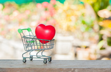 red heart ball in shopping cart