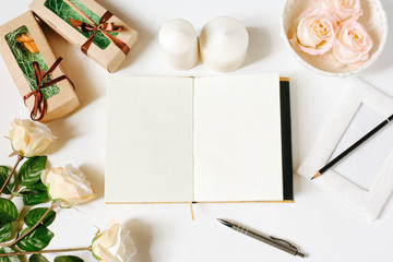 Opened empty diary, pen, vintage tray, candles, roses on white background. Flat Lay, top view, mockup
