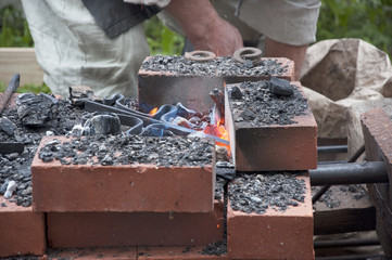 Forged product on charcoal
