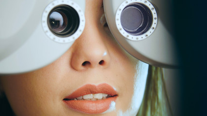 Ophthalmology - young woman checks the eyes on the modern equipment in the medical center