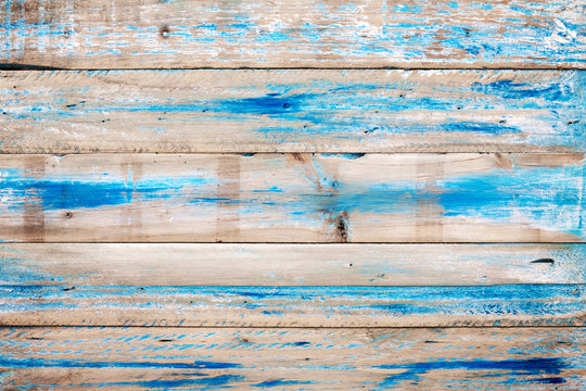 Old wooden background with blue paint. vintage wood texture from beach in summer.
