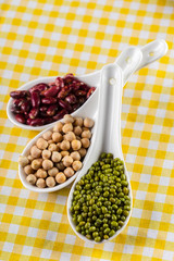 mix of beans on wooden table