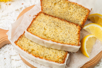 Homemade lemon cake with poppy seeds and sugar glaze. Selective focus © la_vanda