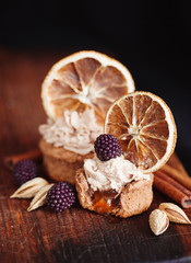almond and orange cupcake with fresh blackberry