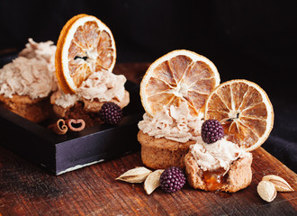almond and orange cupcake with fresh blackberry