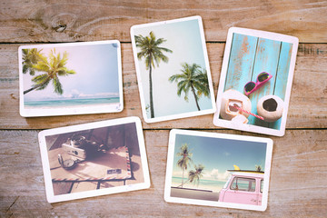 Summer photo album on wood table. Photography from beach vacation - vintage postcards and retro styles