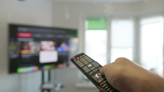 Smart tv and  man hand pressing