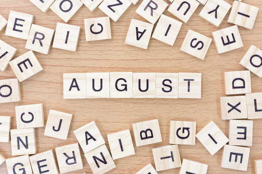 August words with wooden blocks