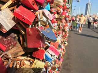 Locks as a symbol of love fastened to a bridge