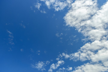 Naklejka na ściany i meble Blue sky with clouds. Looking up view
