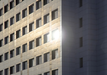 Fototapeta premium High-rise glass building against blue sky