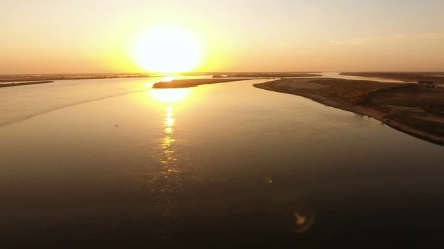 Aerial view of russian river Volga and coastal areas at sunset. The longest river in Europe. Russia. 4K