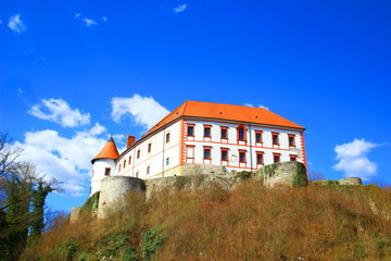 Fototapeta na wymiar Castle on hill, blue sky in background, Ozalj, Croatia