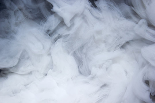 Close up real swirling white smoke background texture / Abstrack photography