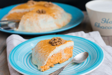 Raw carrot cake on the blue plate