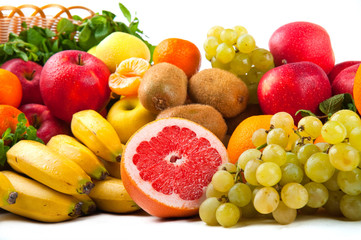 Composition with vegetables and fruits in wicker basket isolated