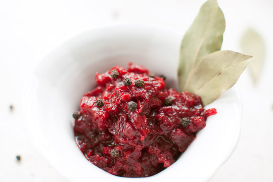 Homemade tomato sauce with bay leaf in the white bowl - Powered by Adobe