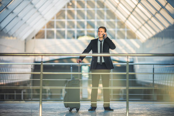 The man with a suitcase phone in the business center