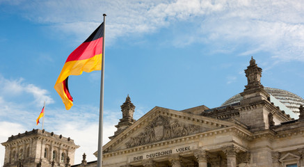 Waving German flag over the Reichstag building in Berlin