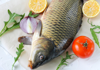  carp with lemon and tomato - fresh river fish