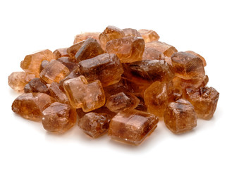 Brown caramelized lump cane sugar cube isolated on white background cutout