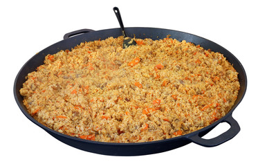 Fast street food of the big city - metal  big frying pan with hot  pilaf.