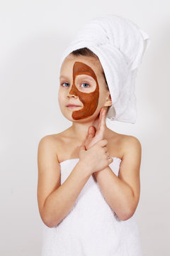 Girl with a clay mask