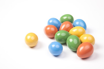 Colored Easter eggs on a white background. Green, red, yellow and blue colors.