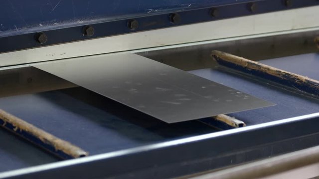 Hydraulic guillotine shear. Thin metal sheet.