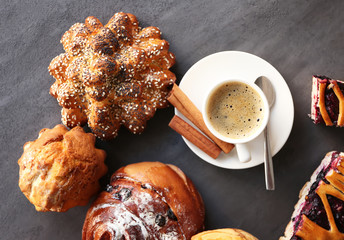 Cup of coffee and different bakery products