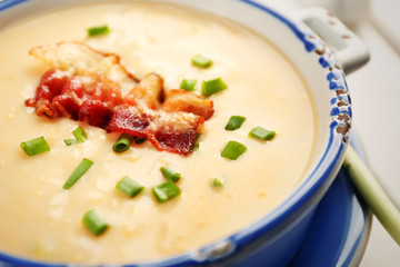 Delicious cream soup with bacon and onion, closeup