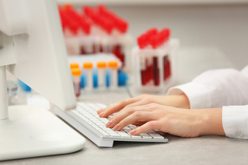 Scientist working with computer at laboratory