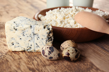 Different dairy products on wooden table