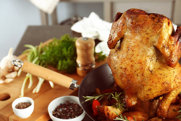 Grilled beer can chicken on kitchen table