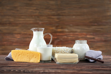 Different dairy products on wooden background