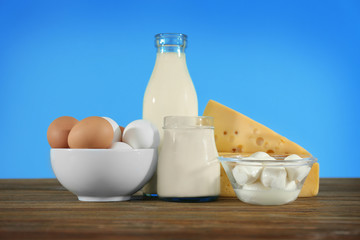 Different dairy products on wooden table
