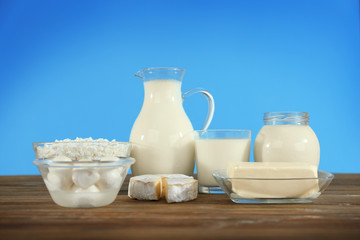Different dairy products on wooden table