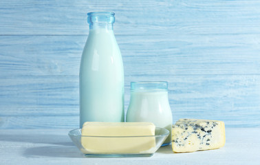 Different dairy products on wooden background