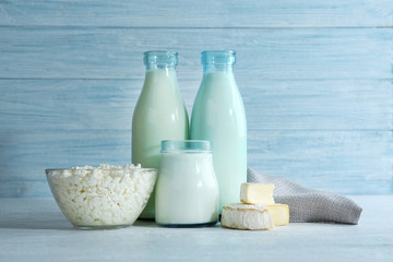 Different dairy products on wooden background