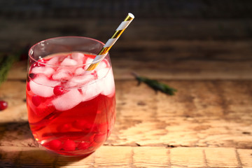 Glass of delicious wine spritzer on wooden table