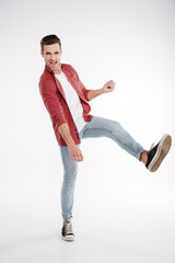 Naklejka premium Vertical image of man playing on imaginary guitar