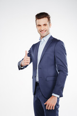 Vertical image of business man showing thumb up